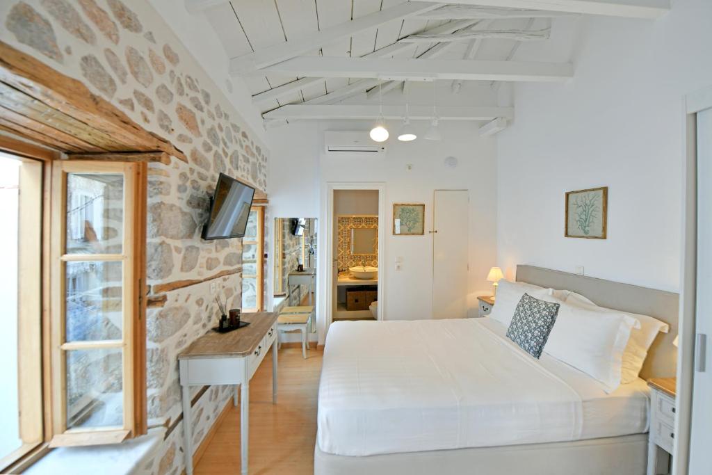 Postel nebo postele na pokoji v ubytování Psaropoula Guest House