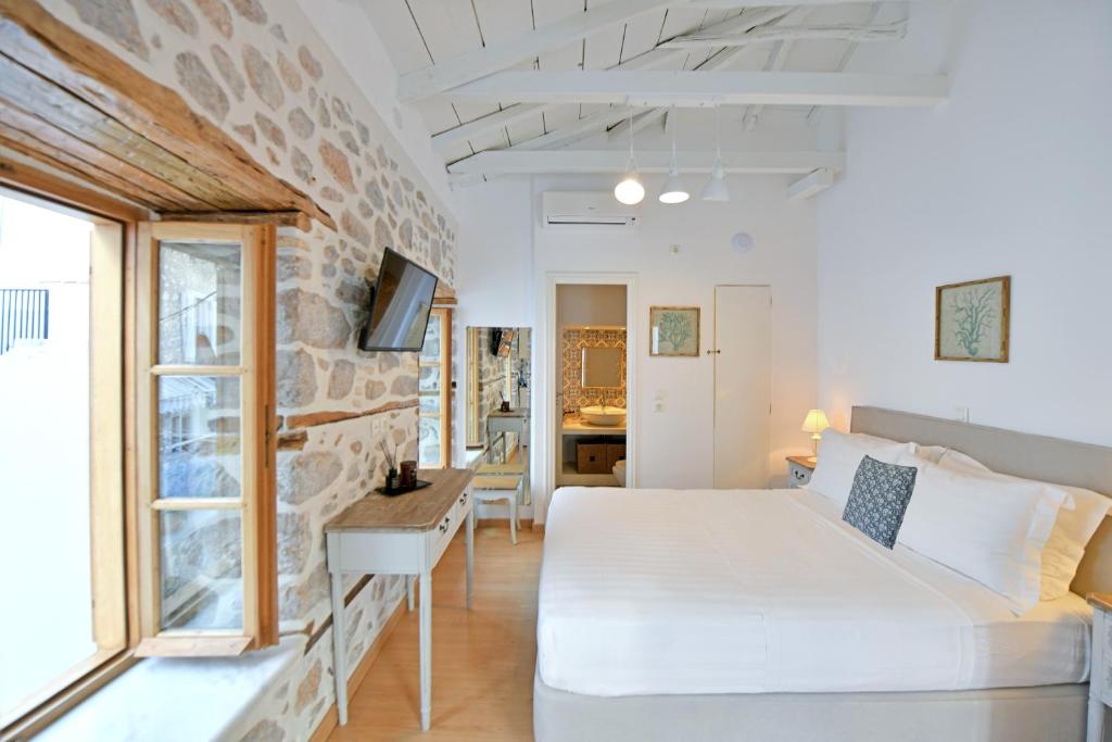 Postel nebo postele na pokoji v ubytování Psaropoula Guest House