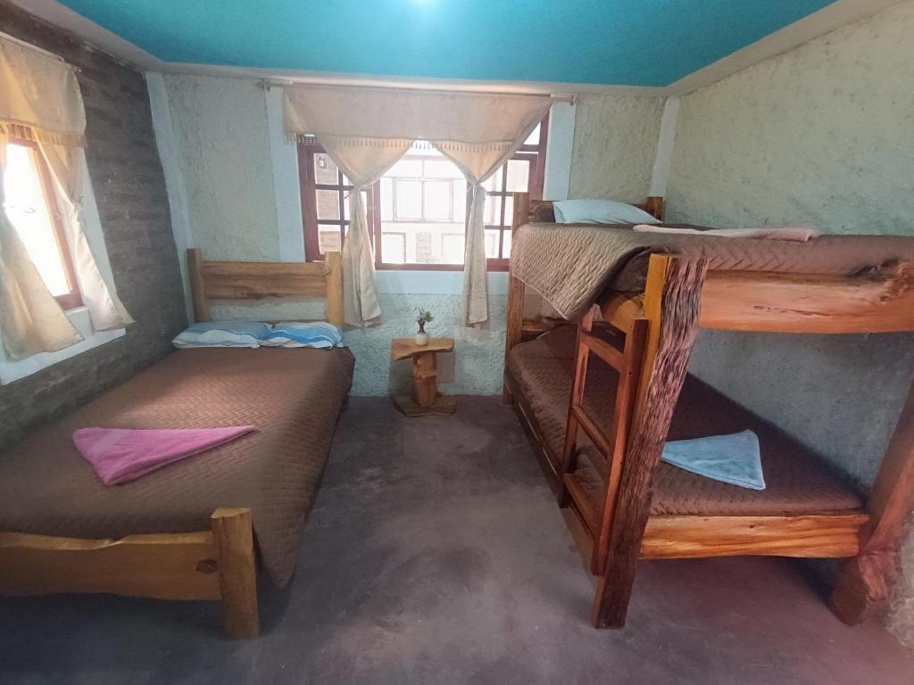 Postel nebo postele na pokoji v ubytování Casa Pukyu Pata