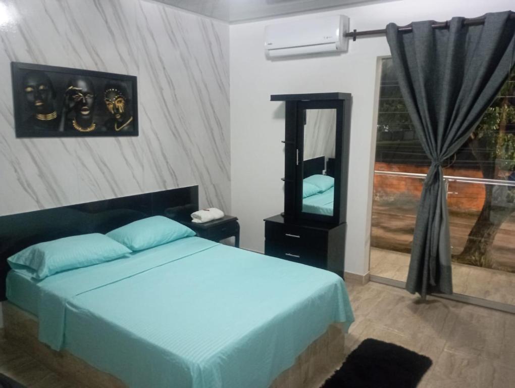 Postel nebo postele na pokoji v ubytování Hotel Palmari