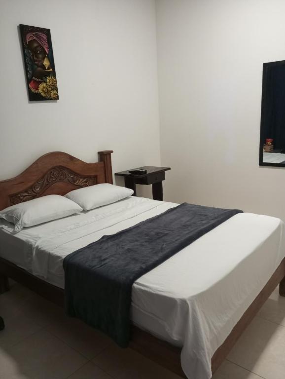 Postel nebo postele na pokoji v ubytování Hotel Palmari
