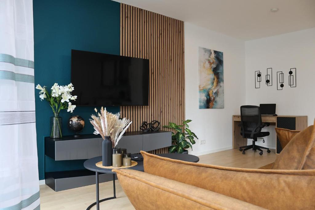 TV a/nebo společenská místnost v ubytování Dream&Stay - City Apartment Papenburg