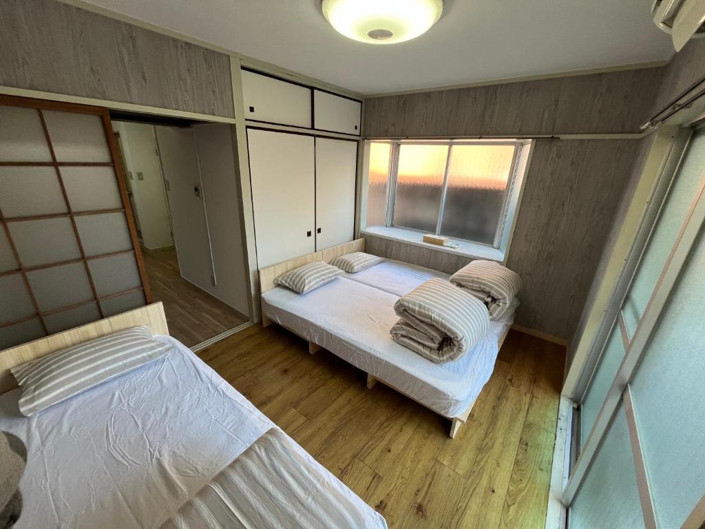 Postel nebo postele na pokoji v ubytování Doragon House