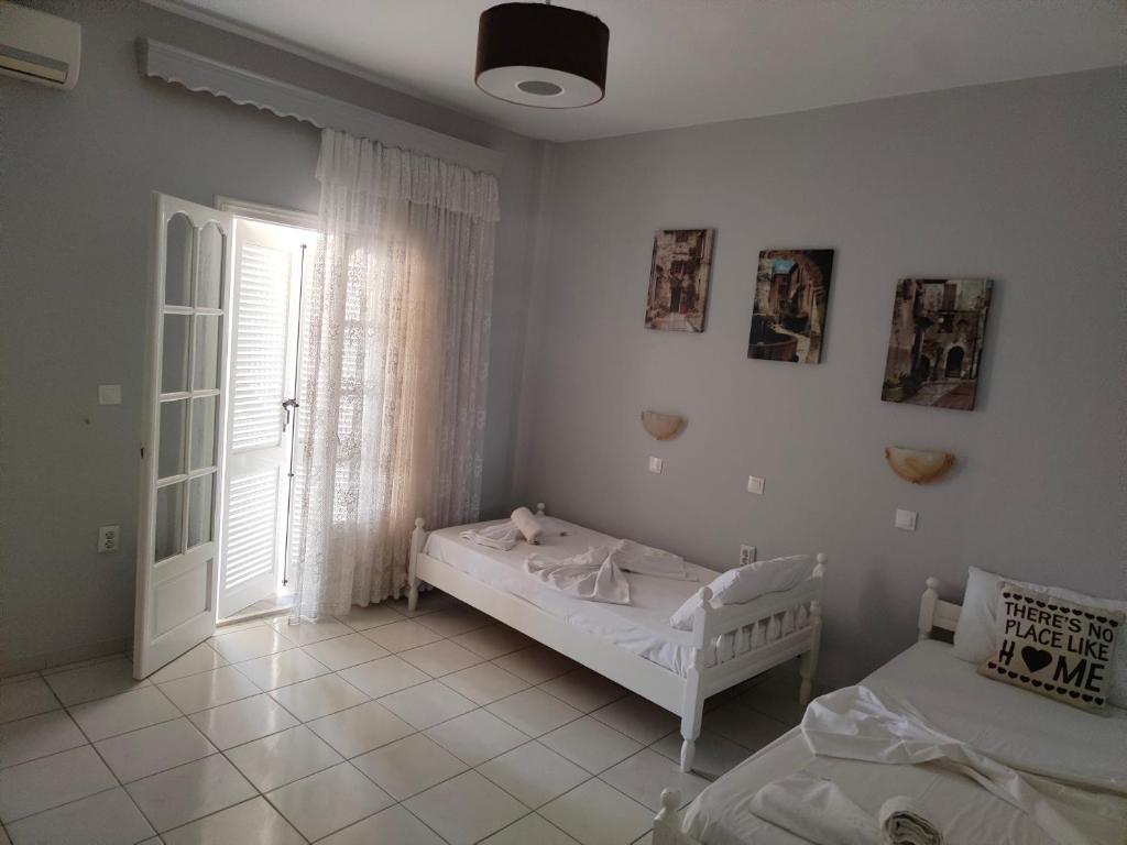 Postel nebo postele na pokoji v ubytování Asprokavos beach apartment and studio