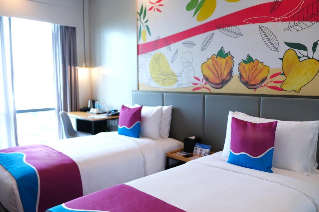 Postel nebo postele na pokoji v ubytování Belmont Hotel Mactan