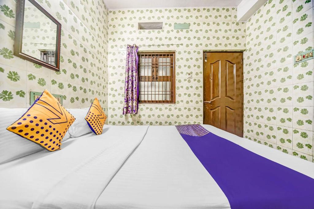 Postel nebo postele na pokoji v ubytování Hotel O Ams Annex