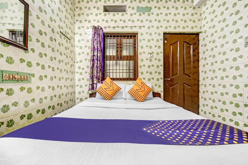 Postel nebo postele na pokoji v ubytování Hotel O Ams Annex