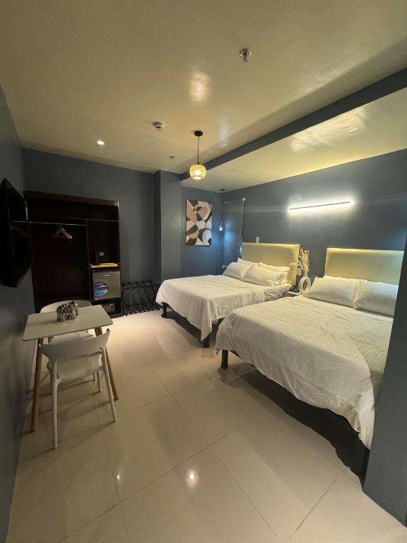 Postel nebo postele na pokoji v ubytování IAO Boutique Hotel