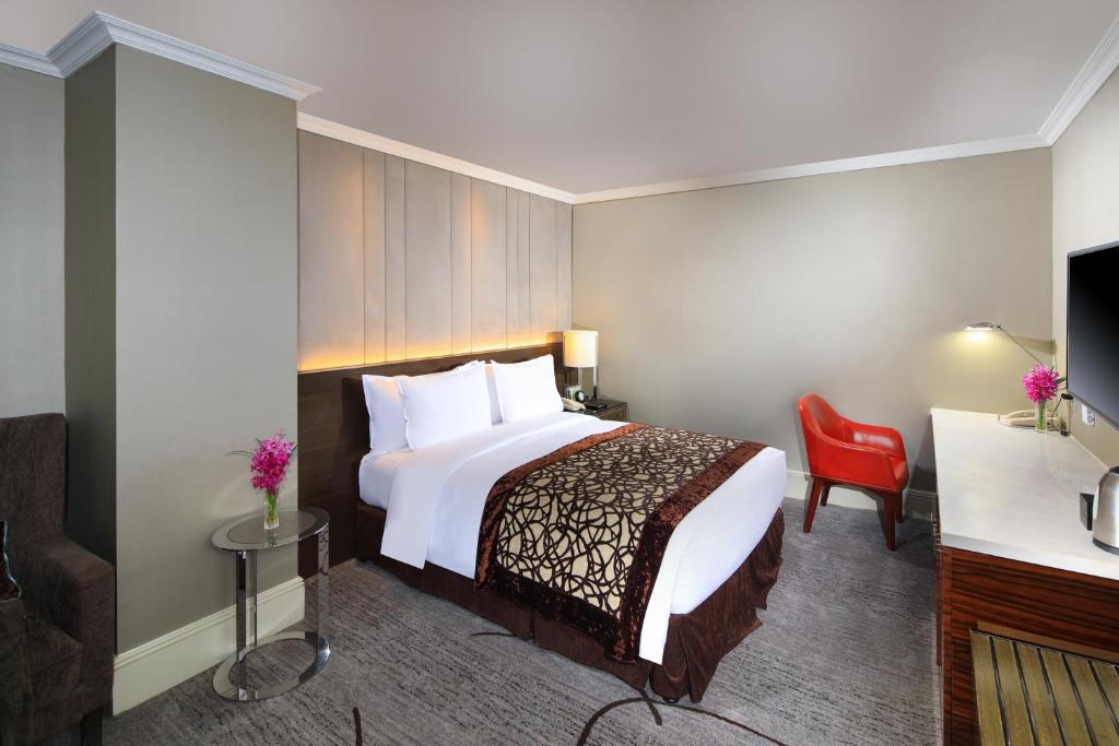Postel nebo postele na pokoji v ubytování Jin Jiang Hotel