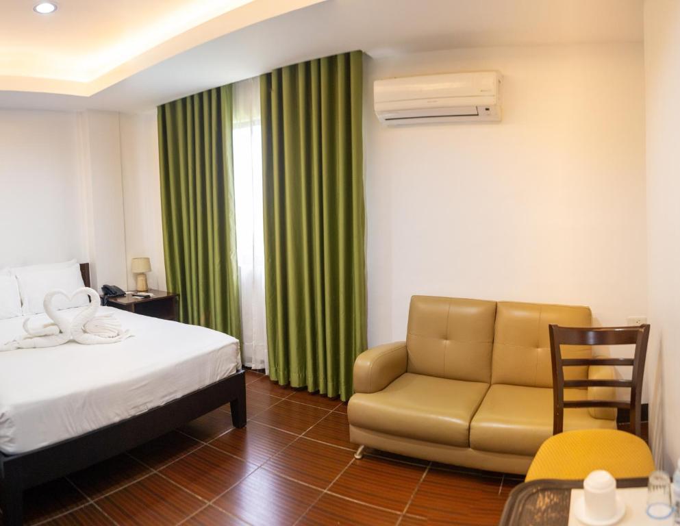 Postel nebo postele na pokoji v ubytování Palmbeach Resort & Spa Mactan, Cebu