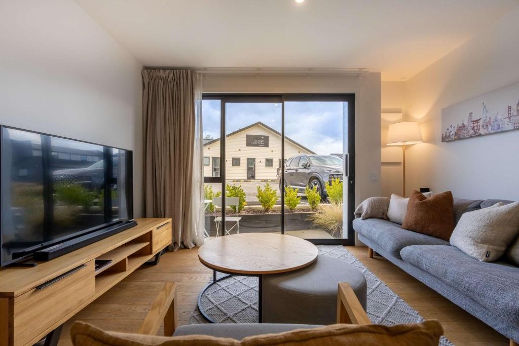 a living room with a couch and a tv at Adventure's Retreat in Albert Town