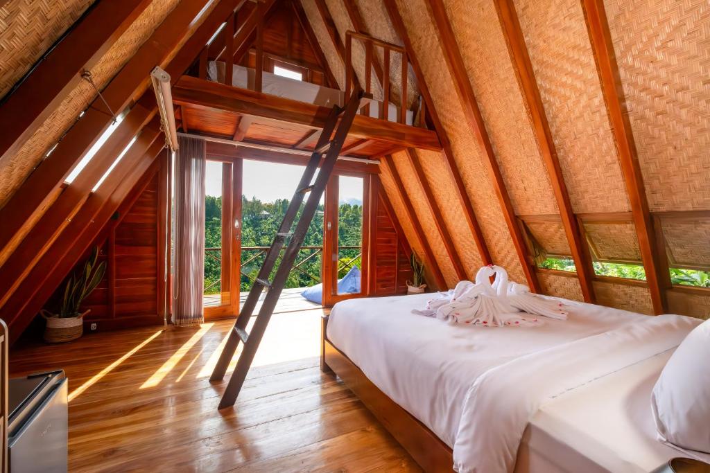 Postel nebo postele na pokoji v ubytování Villa Kayu Amertha
