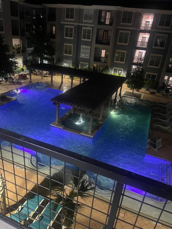 an overhead view of a swimming pool at night at The Frisco Upscale in Frisco