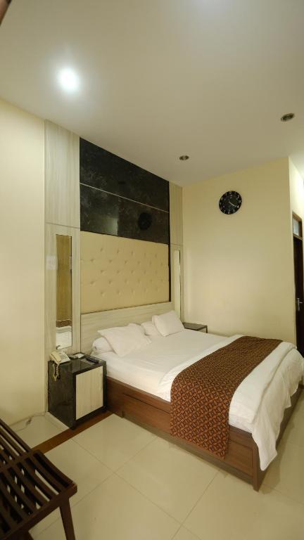 griya desa hotel & pool客房内的一张或多张床位