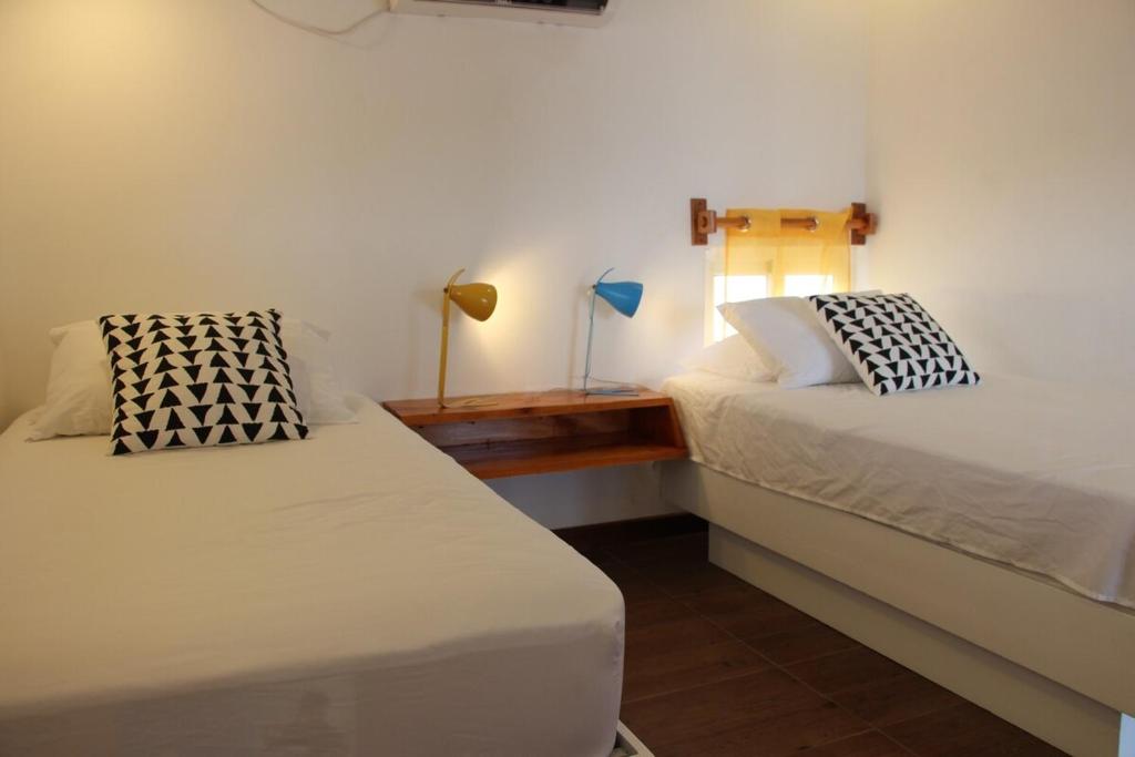 Postel nebo postele na pokoji v ubytování CASA DINIS - Loft - With View Bahia de Portobelo