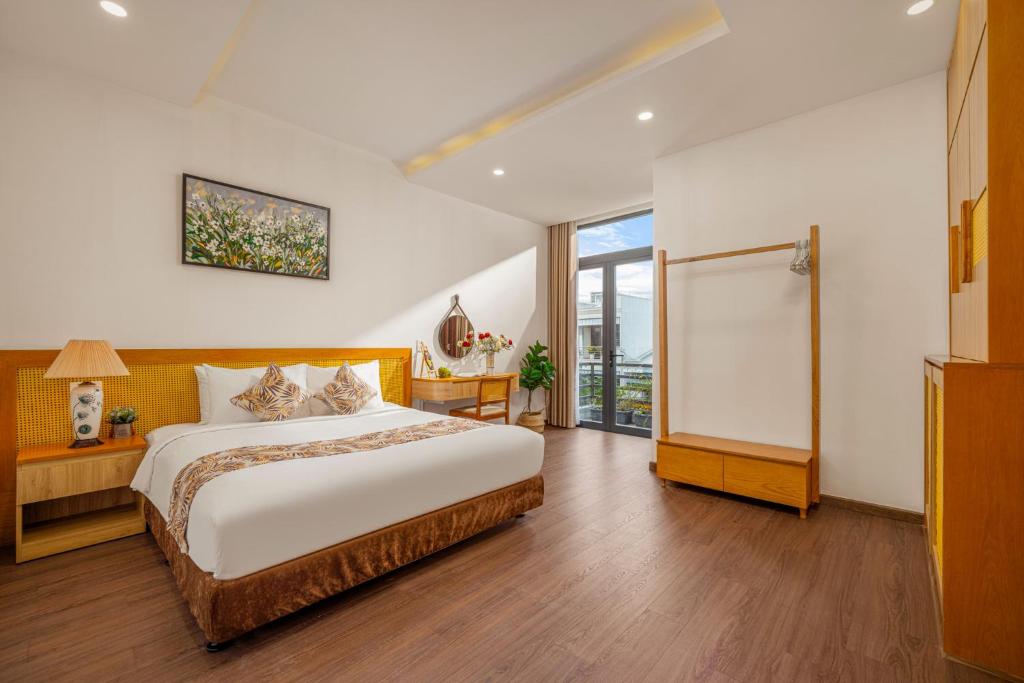 Postel nebo postele na pokoji v ubytování May Home Apartment Da Nang