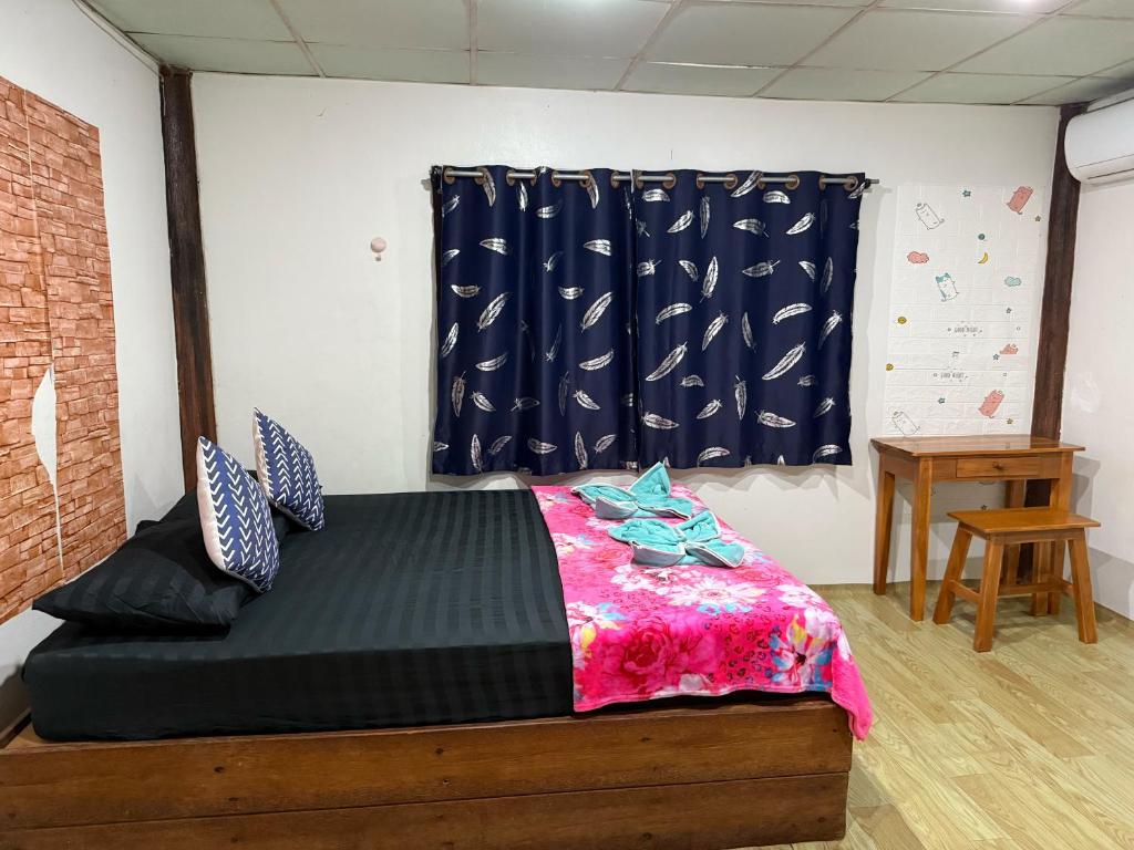 Postel nebo postele na pokoji v ubytování P'Un House