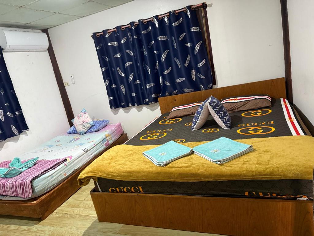 Postel nebo postele na pokoji v ubytování P'Un House