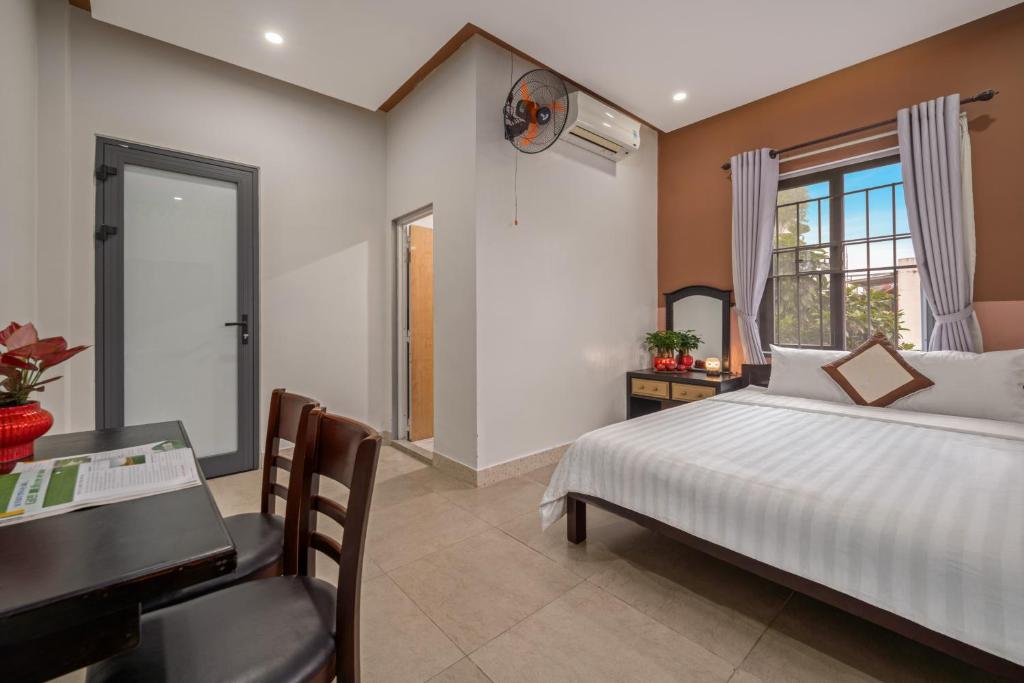 Postel nebo postele na pokoji v ubytování Bo Bo Homestay Hoi An
