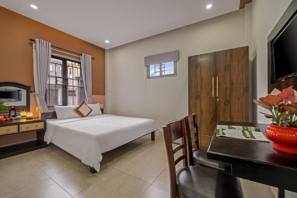Postel nebo postele na pokoji v ubytování Bo Bo Homestay Hoi An