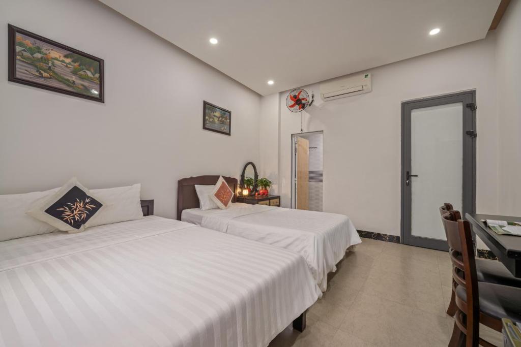 Postel nebo postele na pokoji v ubytování Bo Bo Homestay Hoi An