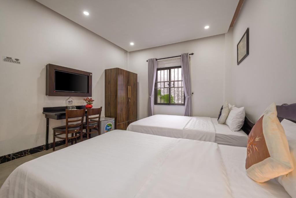 Postel nebo postele na pokoji v ubytování Bo Bo Homestay Hoi An