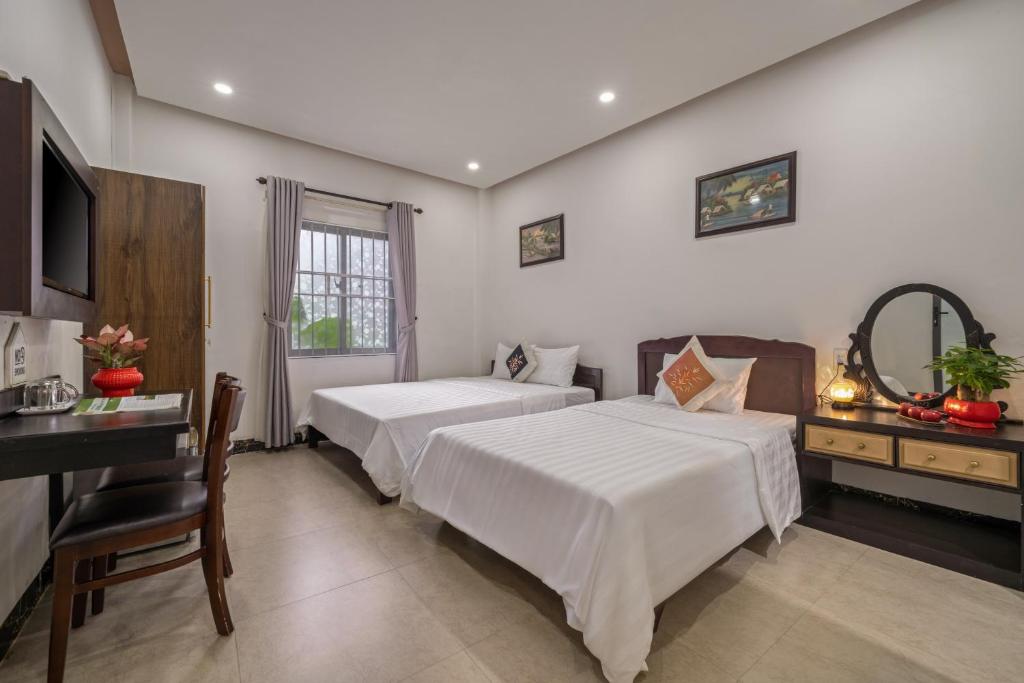 Postel nebo postele na pokoji v ubytování Bo Bo Homestay Hoi An