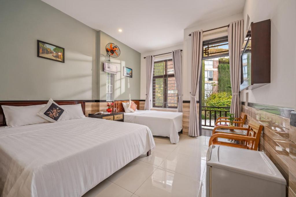 Postel nebo postele na pokoji v ubytování Bo Bo Homestay Hoi An