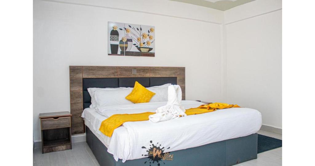 Postel nebo postele na pokoji v ubytování Waffle Suites