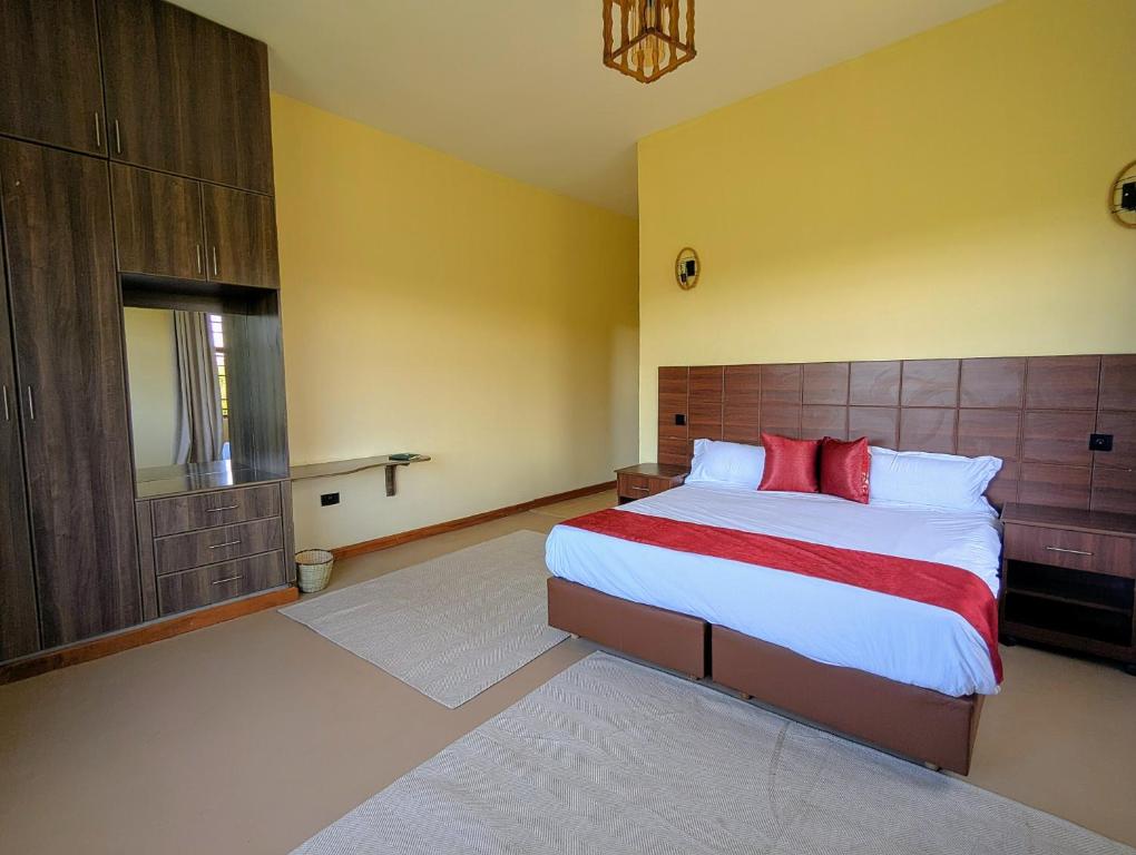 Postel nebo postele na pokoji v ubytování Hillsgate Experience a Luxury Home in Nairobi