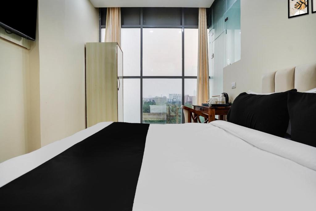 Postel nebo postele na pokoji v ubytování Super Townhouse Sector 63 A Noida