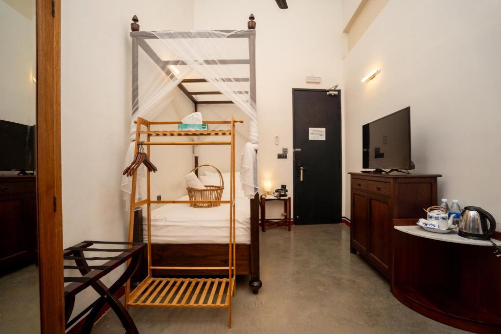 Postel nebo postele na pokoji v ubytování Tian Jing Hotel
