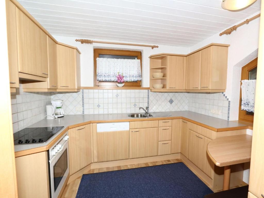 A kitchen or kitchenette at Apartment in Mayrhofen in the mountains
