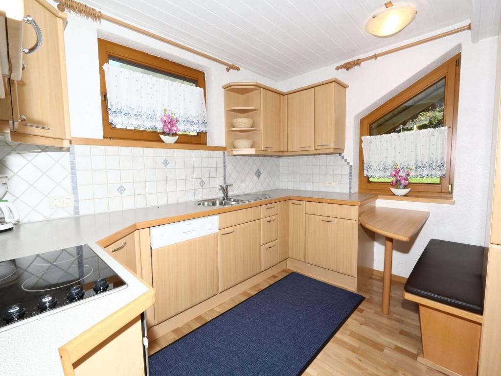 A kitchen or kitchenette at Apartment in Mayrhofen in the mountains