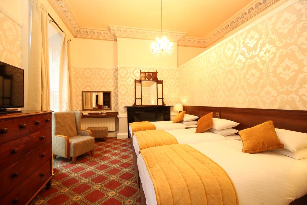Postel nebo postele na pokoji v ubytování Castle Hotel
