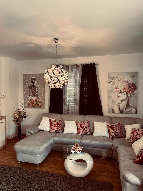 a living room with a couch and a table at Adriatic Escape Apartments in Mokošica