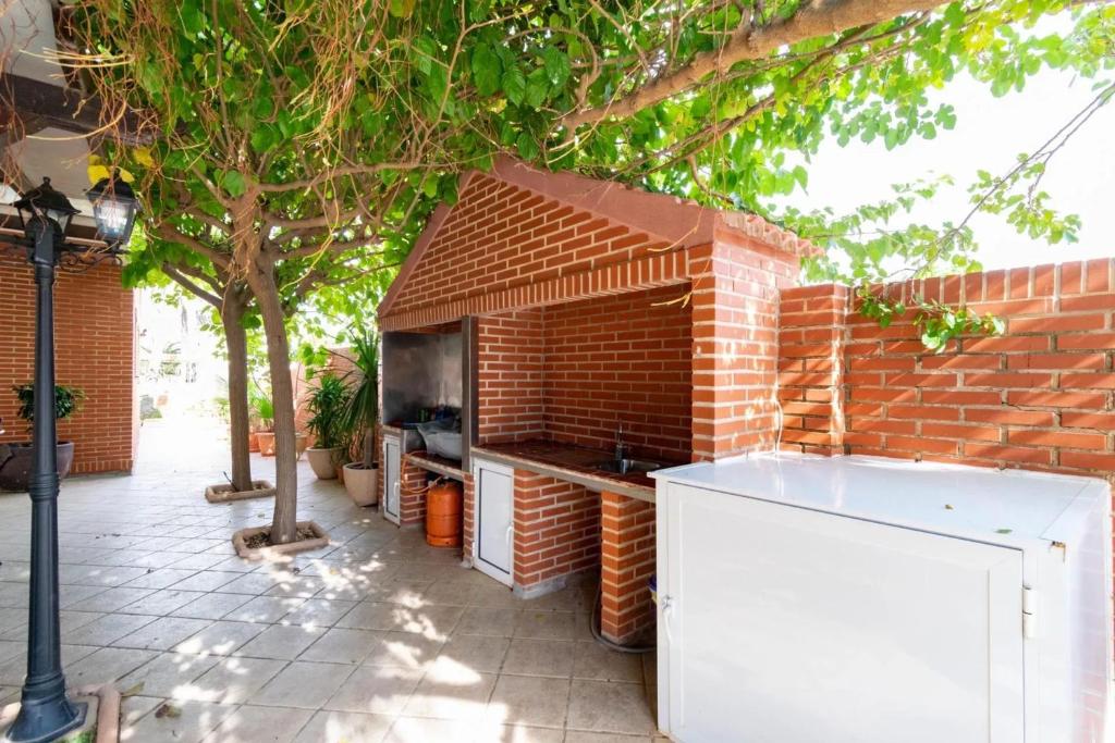 A television and/or entertainment centre at Elegant Villa in Playa Honda with Private Pool