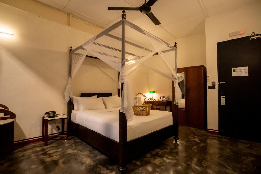 Postel nebo postele na pokoji v ubytování Tian Jing Hotel