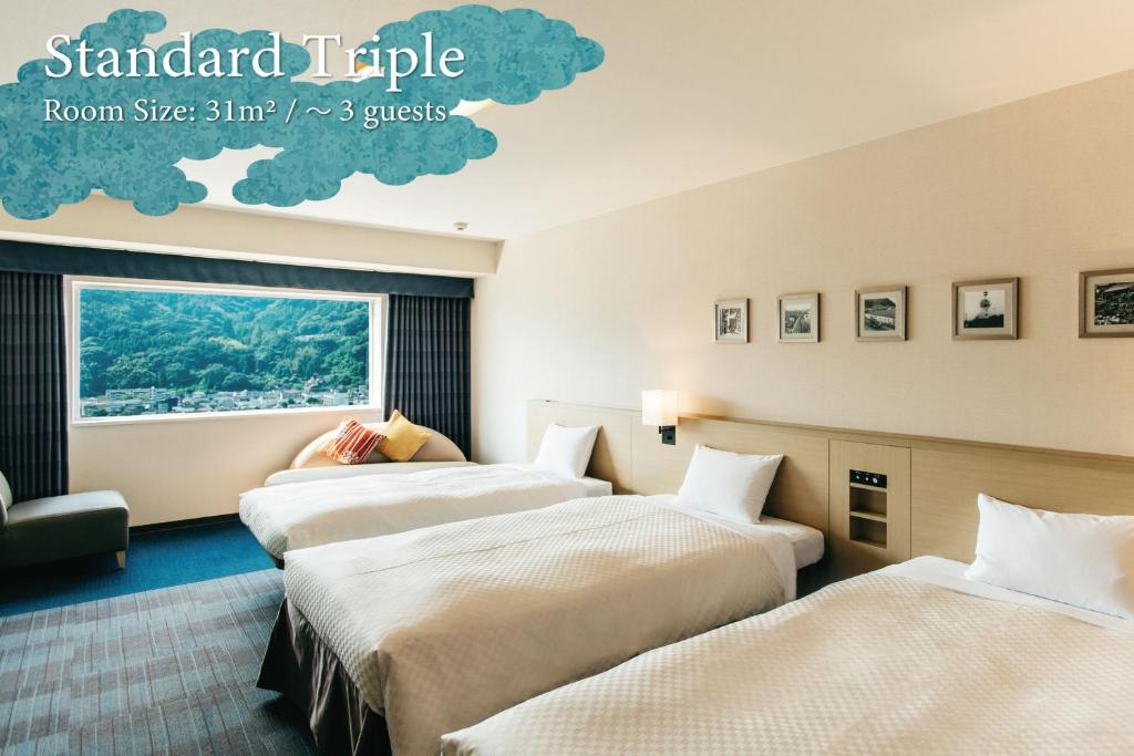 Postel nebo postele na pokoji v ubytování KAMENOI HOTEL Beppu