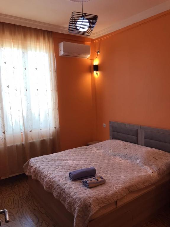 Postel nebo postele na pokoji v ubytování Guest House Kakha