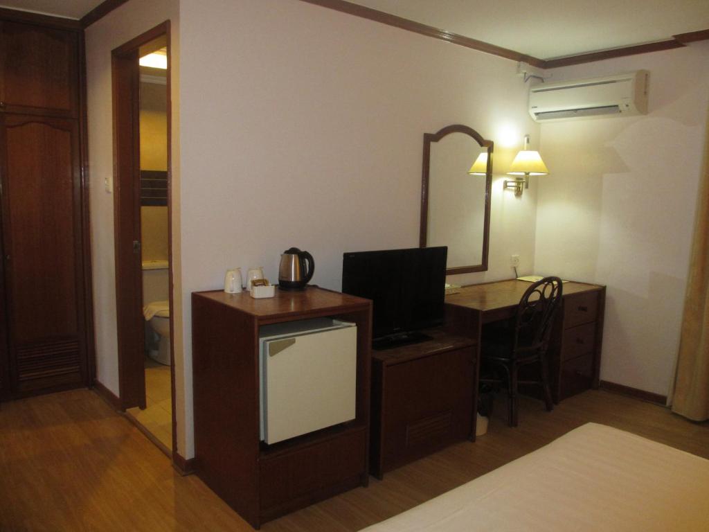 Postel nebo postele na pokoji v ubytování Sanbay Hotel