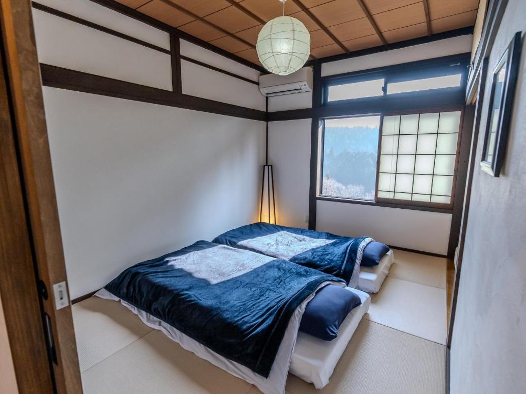 Postel nebo postele na pokoji v ubytování Guesthouse Nedoko