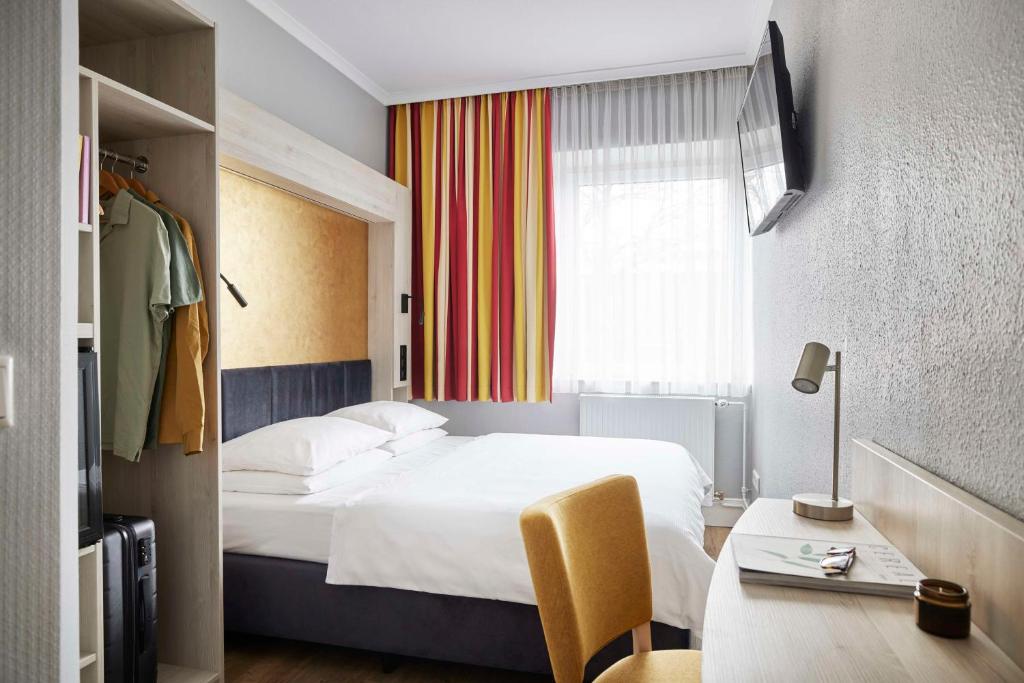 Postel nebo postele na pokoji v ubytování Best Western Raphael Hotel Altona