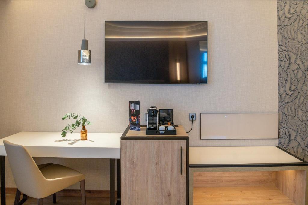 TV a/nebo společenská místnost v ubytování VP SOGNIO Metropolitano