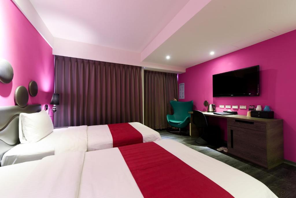Postel nebo postele na pokoji v ubytování Blue Coast Hotel