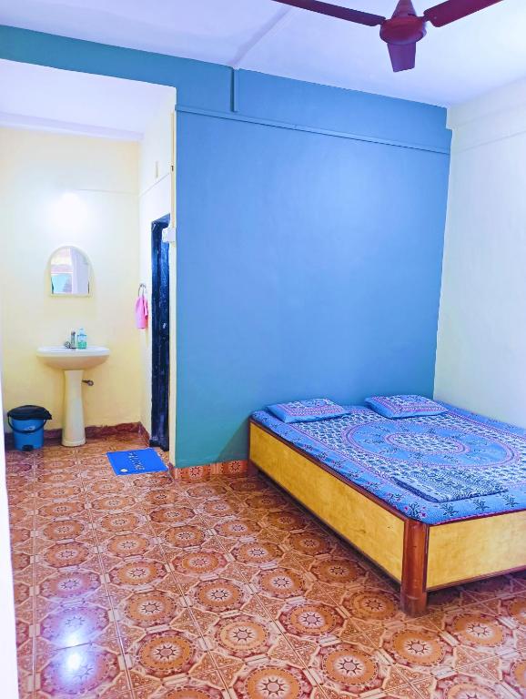 Postelja oz. postelje v sobi nastanitve Sujit Guest House