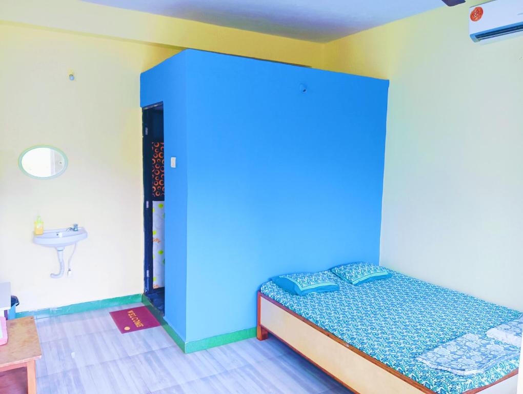 Postelja oz. postelje v sobi nastanitve Sujit Guest House
