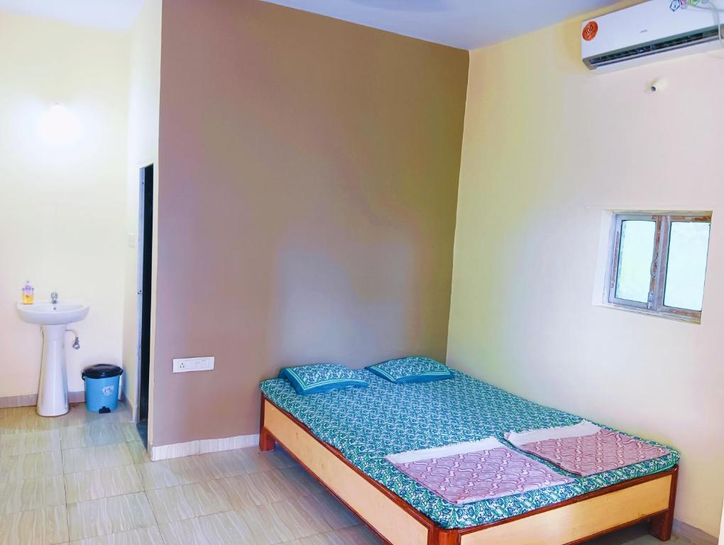 Postelja oz. postelje v sobi nastanitve Sujit Guest House