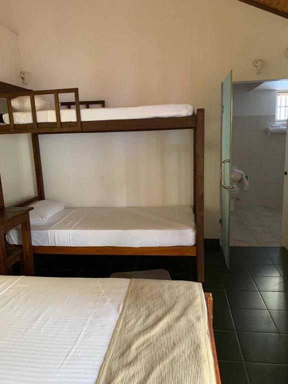 Postel nebo postele na pokoji v ubytování Mel's Inn