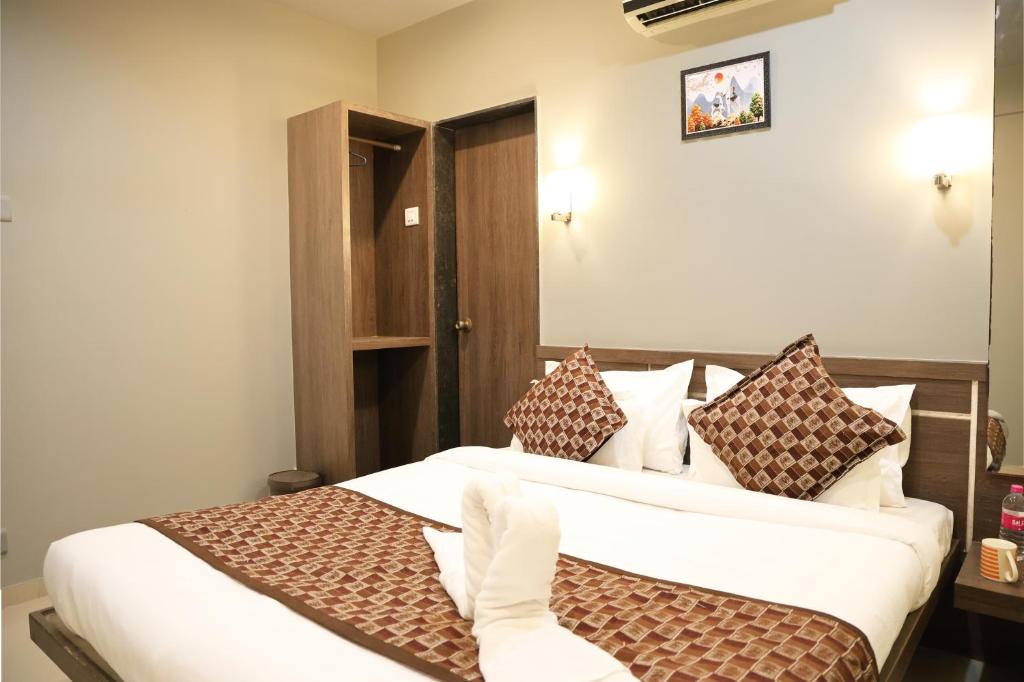 Postel nebo postele na pokoji v ubytování The Viviana Hotel